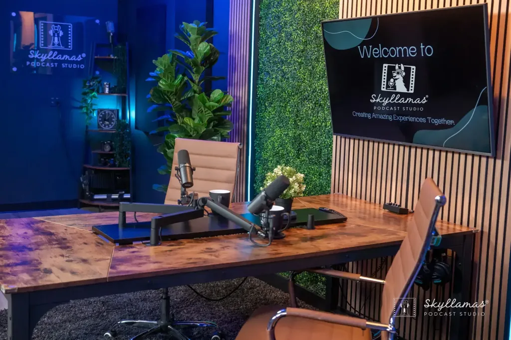 The Skyllamas Podcast Studio desk set with microphones and blue lighting