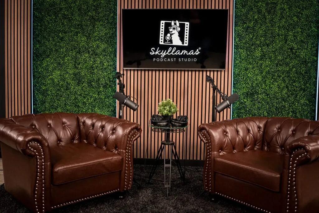 The Skyllamas couch set with two leather chairs and the studio logo