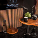 chair and table with microphones for podcasting